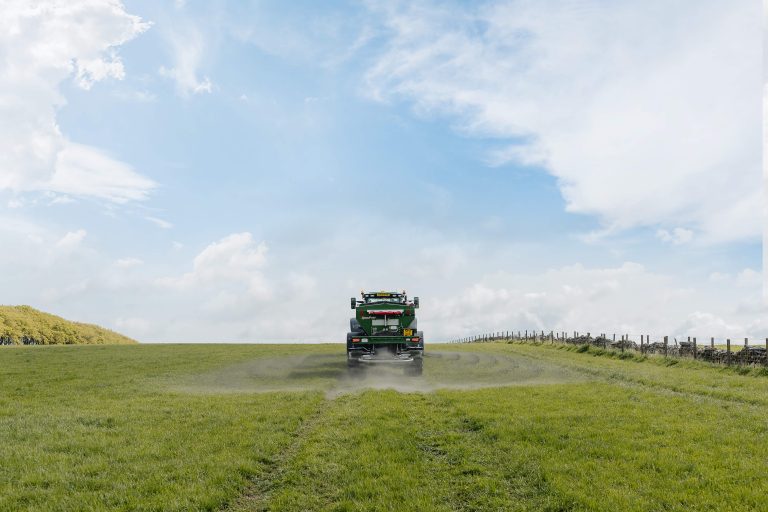 Machine spreads rock dust on fields