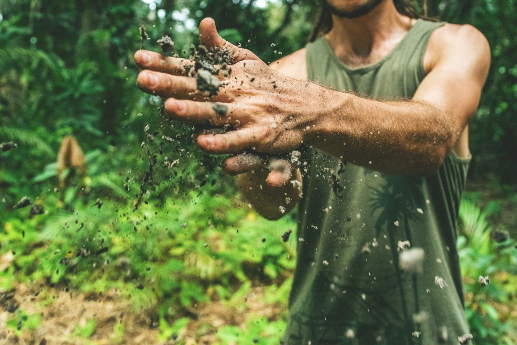 Man with soil in hands