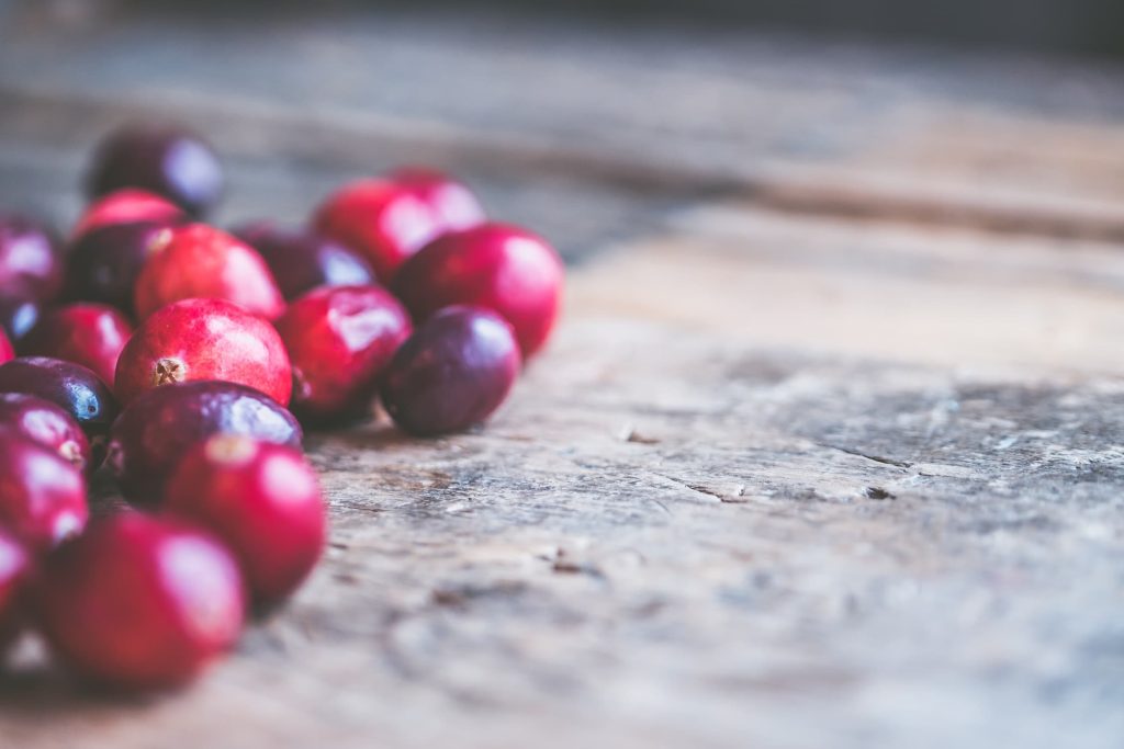 Close-up of cranberries on wooden surface